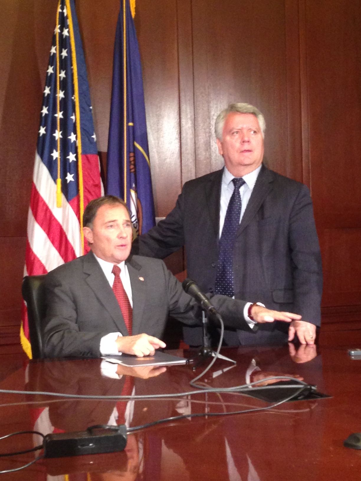 Utah Governor Gary Herbert and Executive Director of the Utah Department of Health Dr. W. David Patton speak at a press conference on April 16, 2014.